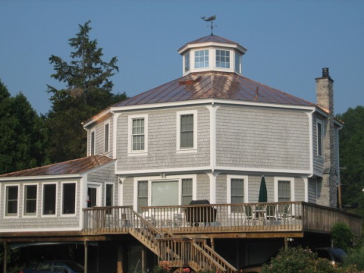 New copper standing seam roof on octagon house overlooking the Hudson River at Van Wies Point, NY